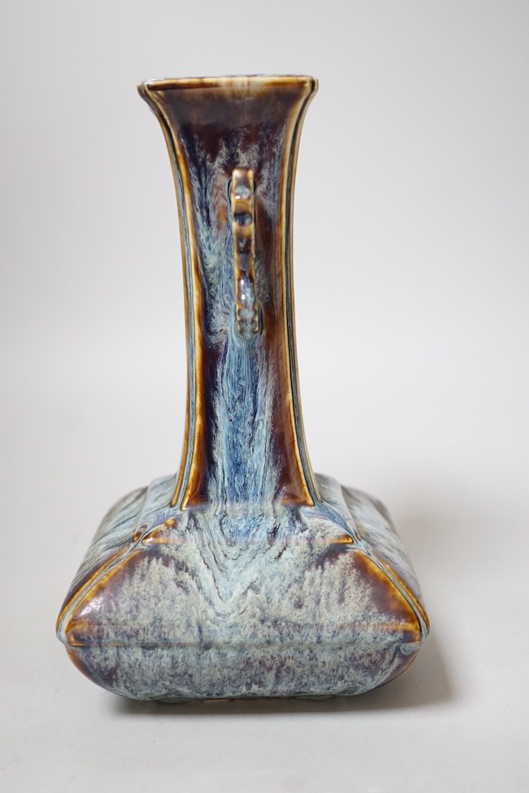 A Chinese Shiwan two handled vase, 23cms high